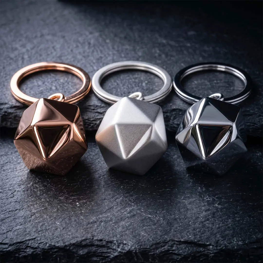 Bespoke OEM keychain engineering showcasing rich rose gold, pearl matte silver, and polished chrome plating tailored for the fashion industry.
