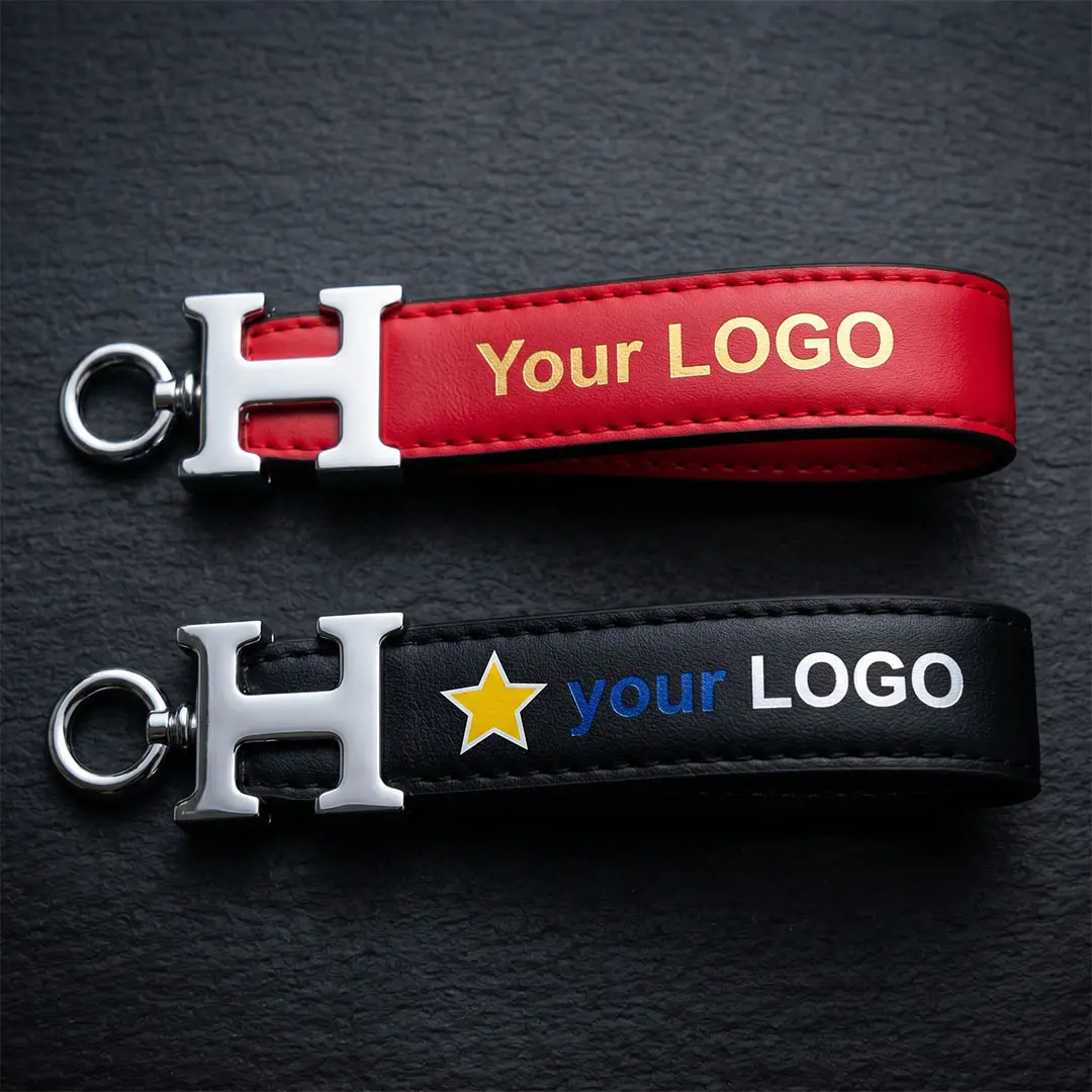 High-volume custom corporate keychain featuring commercial PU leather strap and golden silkscreen logo for enterprise event gifting.