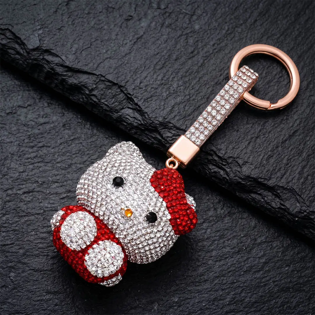 Custom 3D character mascot bag charm featuring high-volume silver and red optical-rhinestone application with a matching crystal strap.