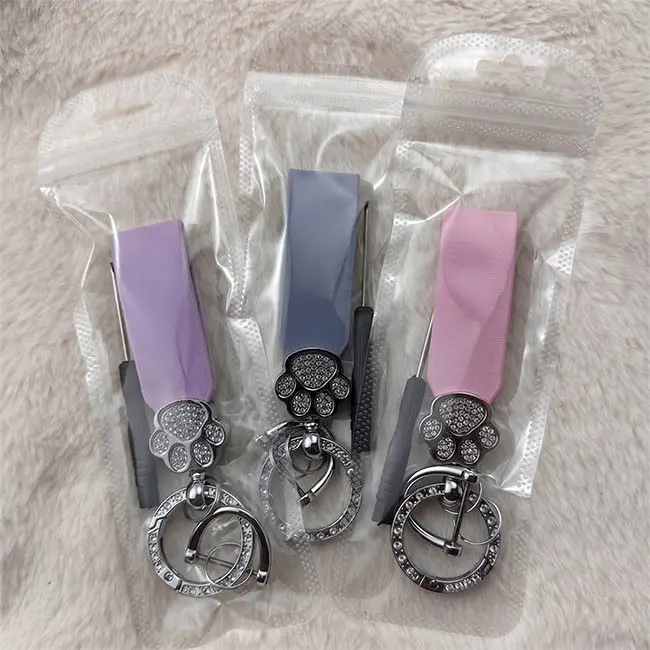Custom rhinestone keychains co-packed with small 8cm screwdrivers inside clear OPP polybags for easy end-user assembly.