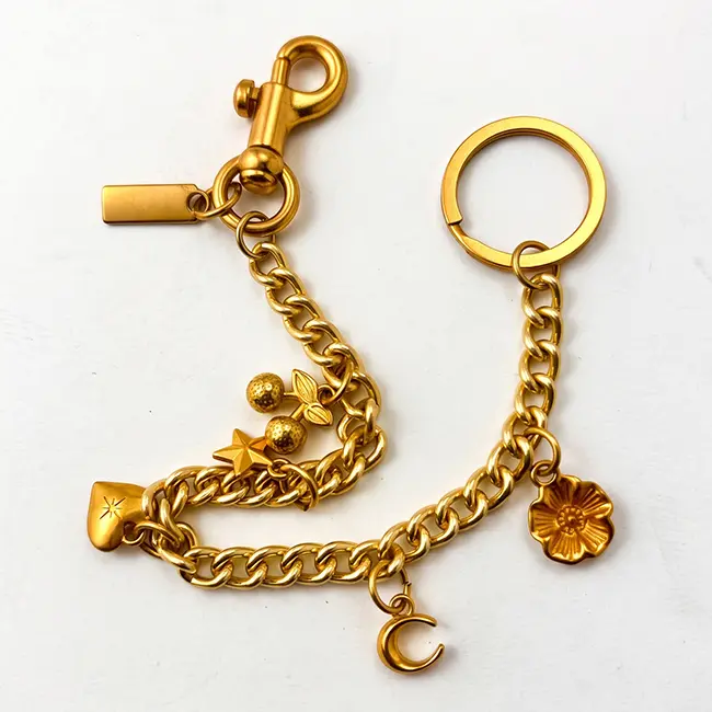 Vista principal de cadenas extensoras para bolsos en aleacion de zinc oro claro con cuatro perlas sinteticas grandes de 18mm y flor incrustada de cristales