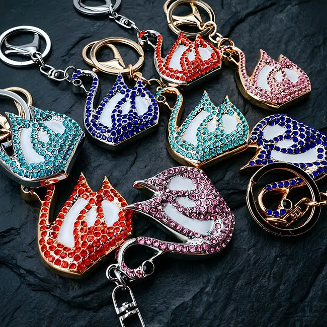A hardware assembly close up view of the B2B optical crystal molding accessory highlighting both the light gold and silver zinc alloy plating options on the vibrant rhinestone goose charms.