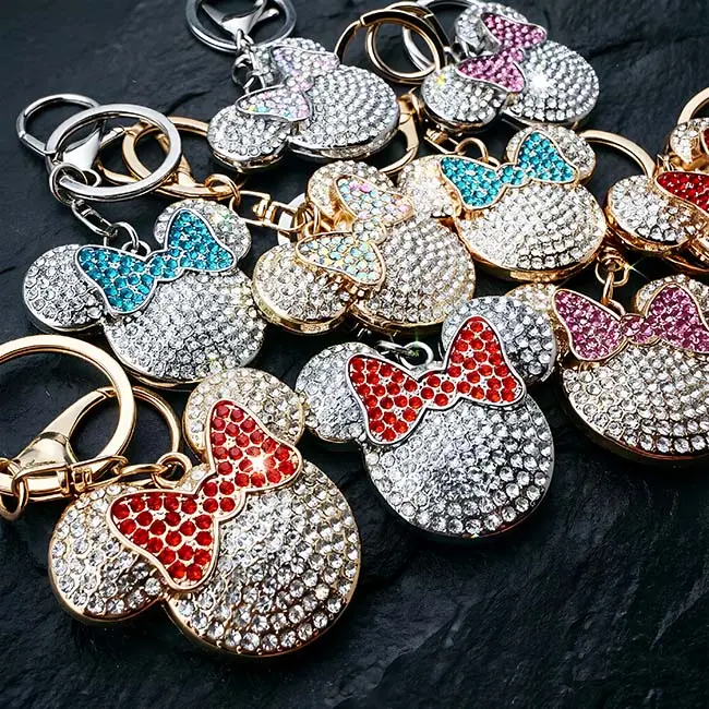 A hardware assembly close up view of the B2B optical crystal molding accessory beautifully highlighting both the premium light gold and sleek silver zinc alloy plating options on the rhinestone mouse head charms.